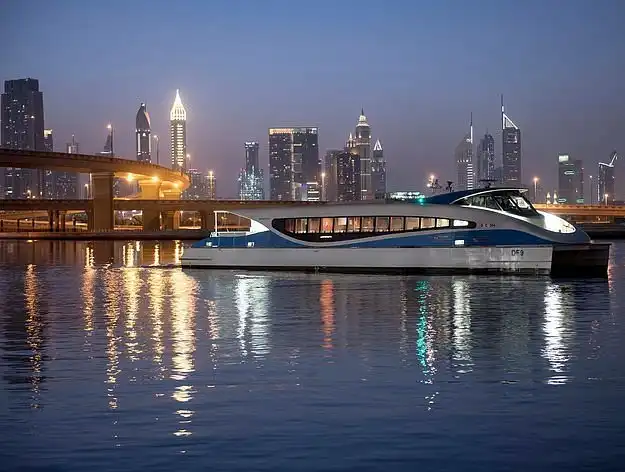 Tourists enjoying a over dubai ferry